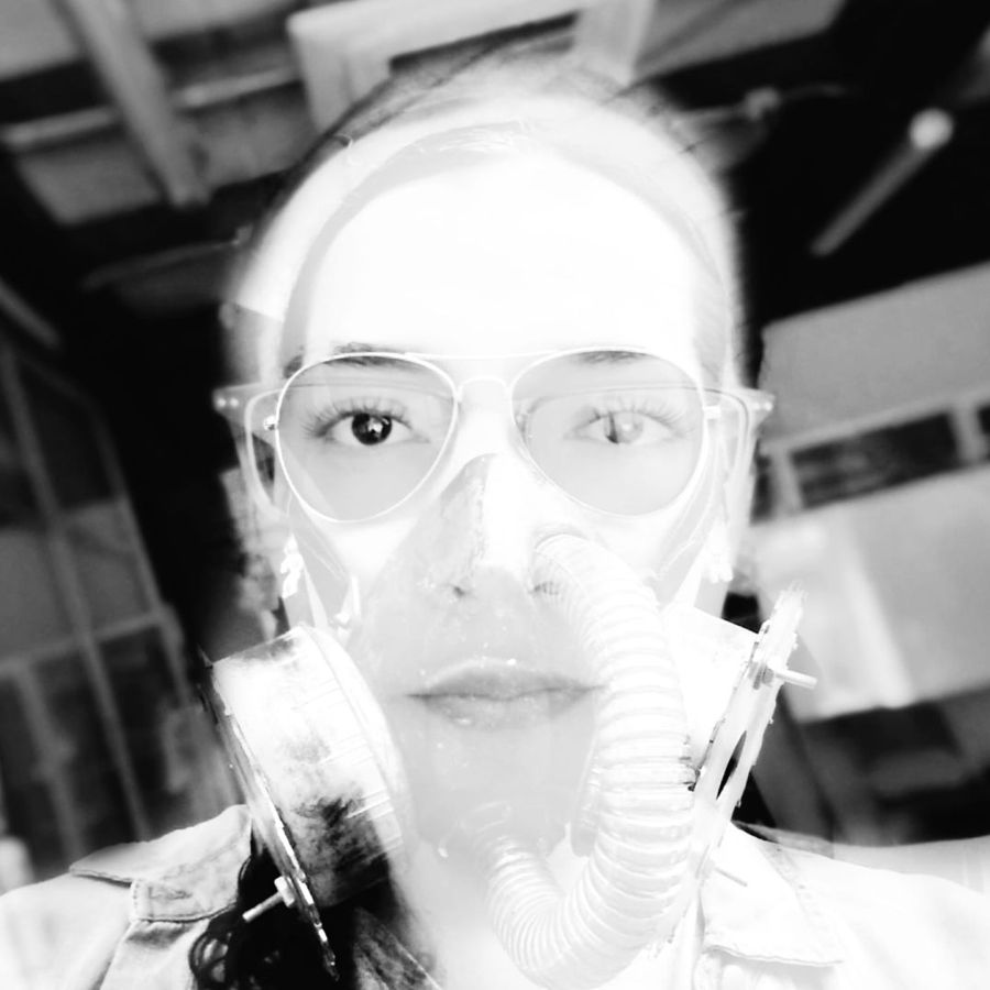 Celeste Betancur in a workshop, wearing safety glasses and a respirator